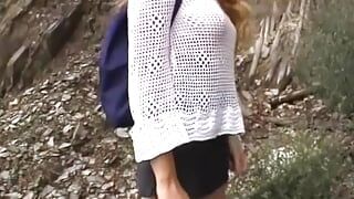 An amazing German blonde pleasing her shaved muff while mountain climbing