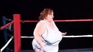 Fat midget girl is shoving a dildo in lesbian midget’s pussy