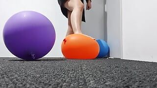 Women Popping balloons, stomping on balloons