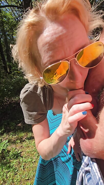 Wife gives quick handjob while walking at the park