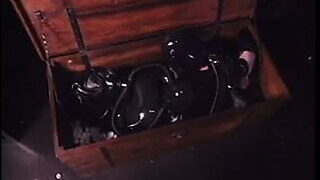 Bondage Latex girl locked in box