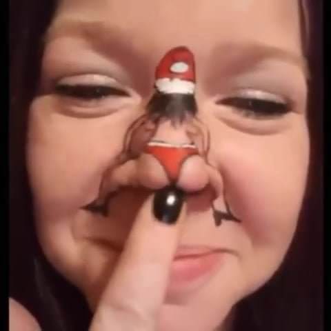 Dancing Santa on girl’s nose