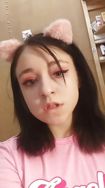 Daytime home striptease in a pink t-shirt and showing off beautiful breasts. Close-up