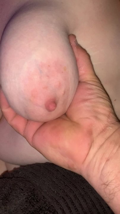 Playing with her big saggy tits