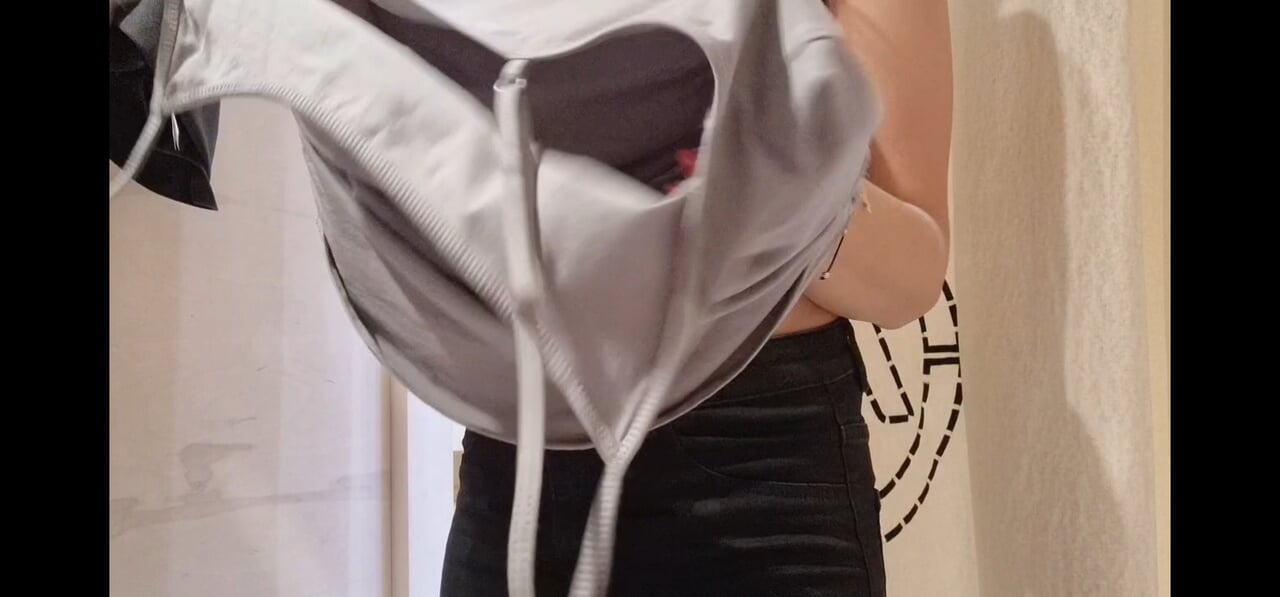 the curtain in the fitting room is open, I flash my tits